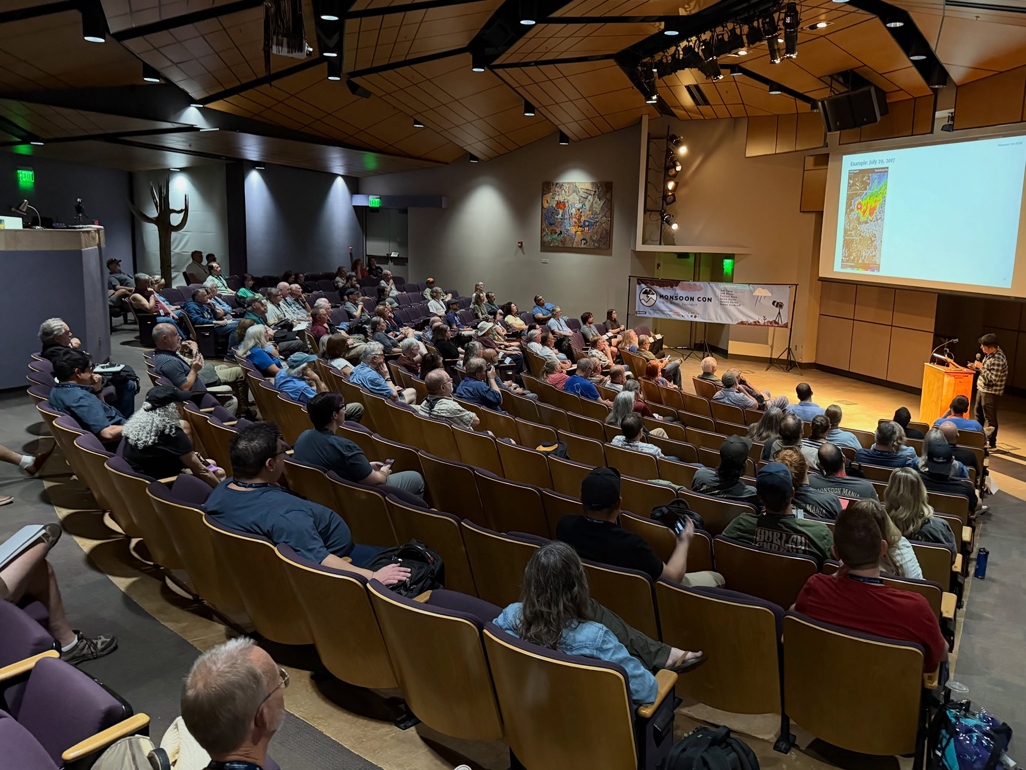 Monsoon Con Attendees listen to Jim Tang's keynore speech in 2026